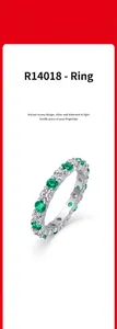 Elegant S925 silver eternity ring with alternating green and clear moissanite stones.