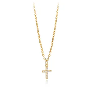 Close-up of a gold-plated S925 silver cross necklace pendant featuring sparkling zircons.