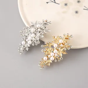 Detail of elegant alloy hair clips with pearls and rhinestones in gold and silver