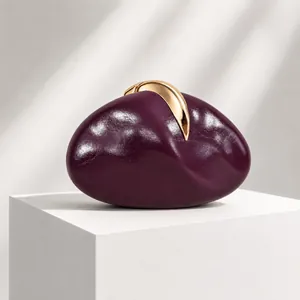 Unique pebble-shaped purple PU leather clutch bag with gold metallic clasp for evening