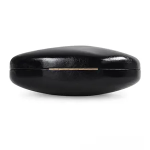 Detailed side view of a glossy black PU evening clutch bag with a golden metal hinge