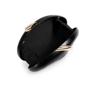 Macro view showing the black fabric lining and golden clasp of the PU evening clutch