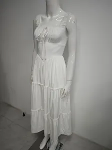 Detailed view of white square neck tiered maxi dress with ruffles on white mannequin