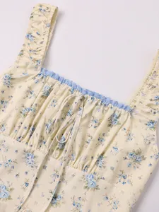 Close-up of a floral square neck dress featuring ruffle straps and center tie detail