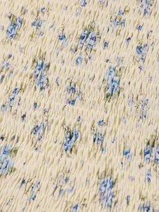 Macro view of smocked floral print fabric detail for a French style summer dress
