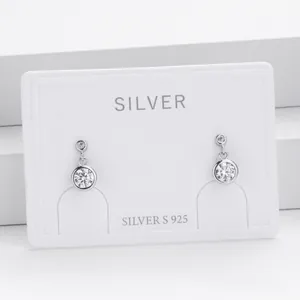 Close-up detail of S925 sterling silver stud earrings featuring round cubic zirconia