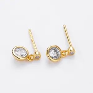 Close-up of minimalist S925 silver gold-plated stud earrings with cubic zirconia.