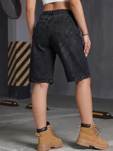 Detailed back view of women's washed black denim bermuda shorts with classic pockets