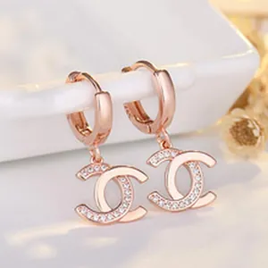 Elegant rose gold plated s925 silver hoop earrings with pavé set interlocking C logo charm.