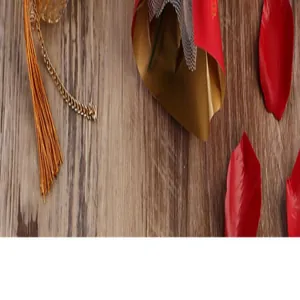 Detailed macro view of elegant gift packaging with golden tassel and red petals