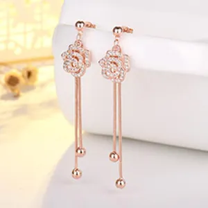 Elegant rose flower tassel earrings with rose gold finish and sparkling pavé stones detail