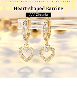 Close-up of gold-plated heart earrings with pave-set AAA zircon stones