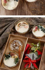 Detailed view of luxury scented candle gift set with dried flowers and rose bouquet