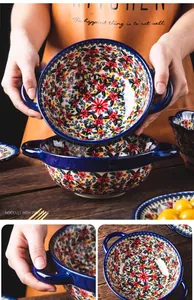 Detail shot of floral ceramic noodle bowl with double handles and vintage pattern.