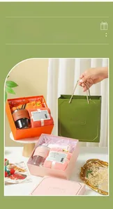 Detailed view of gift set featuring a glass mug and towel in elegant packaging.