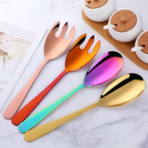 Macro detail of large colorful stainless steel buffet serving spoons and forks set