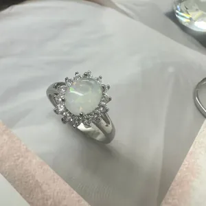 Elegant stainless steel sunflower ring with oval opal and sparkling cubic zirconia
