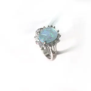 Elegant stainless steel sunflower ring with round opal and cubic zirconia accents