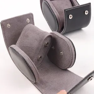 Detail view of luxury grey PU leather watch roll storage box with soft removable cushion.