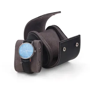 Elegant black PU leather watch box with removable grey suede pillow and snap closure