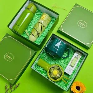 Green corporate gift set with insulated thermos, umbrella, mug, handheld fan and cream