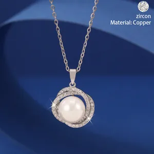 Elegant silver-toned necklace featuring a central pearl surrounded by zircon pave circles.