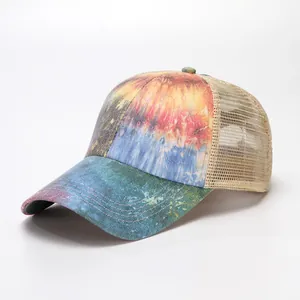 Women's mesh baseball cap with vibrant tie-dye galaxy print, shown from a side perspective
