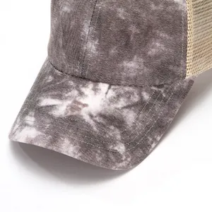 Macro detail view of tie-dye starry pattern baseball cap with breathable mesh back