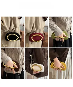 Präsentation von Retro-Clutch-Taschen in verschiedenen Farben mit goldenem Metallgriff