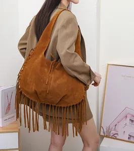 Large brown suede shoulder bag with vintage fringe details and stylish dumpling shape