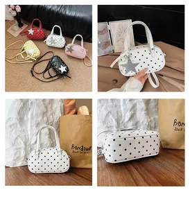 Chic polka dot bowling style handbag with star charm, versatile crossbody bag for women