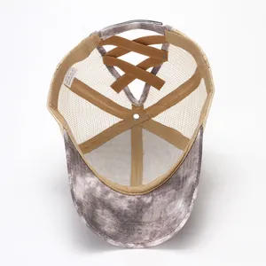 Internal view of tie-dye mesh ponytail baseball cap showing criss-cross back detail