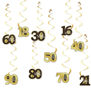 Close-up of gold and black birthday hanging swirls decorations with milestone age numbers