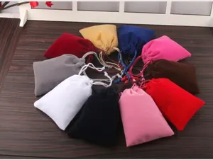 Collection of vibrant and colorful velvet drawstring pouches for jewelry storage
