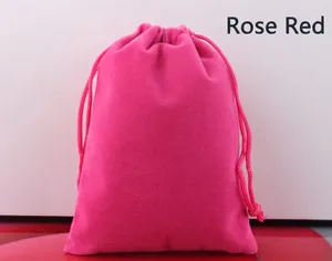 Close-up of a vibrant rose red velvet drawstring pouch for jewelry and accessories.
