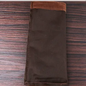 Detail view of the brown velvet storage pouch showing fabric texture and stitching