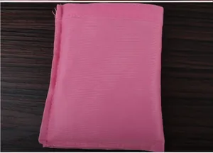 Close-up detail of the soft pink velvet texture on a small jewelry storage drawstring pouch
