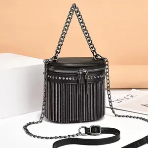 Elegant black PU leather bucket bag with silver fringe tassels and chunky metal chain