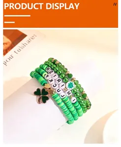 Close-up of St. Patrick's Day green bead bracelet set with lucky clover charm pendant