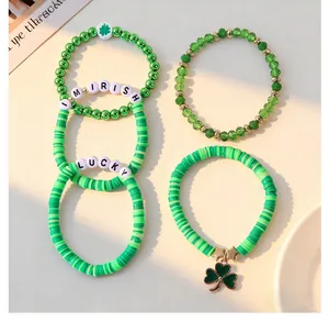 Detailed view of green St. Patrick's Day beaded bracelet set with shamrock charm.