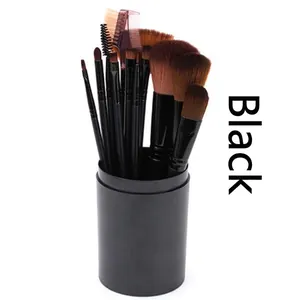 A 12-piece professional makeup brush set neatly stored in a matte black travel tube