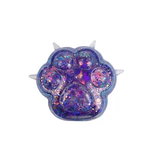 Cute cat paw squishy toy with iridescent glitter sequins for stress relief and fun.