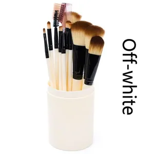 Detail view of 12pcs makeup brush set with soft bristles in a cream cylinder container