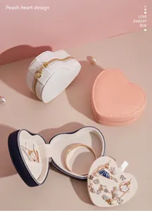 Interior and exterior detail of portable heart-shaped jewelry storage boxes in various colors