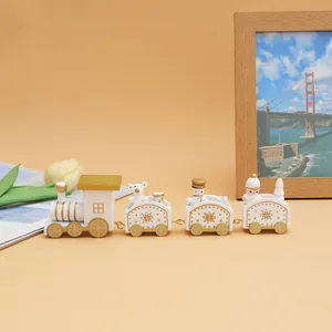 A white and gold wooden Christmas train set featuring bear and snowman figurines