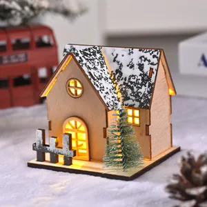 Illuminated wooden Christmas LED house ornament with snowy roof and mini pine tree
