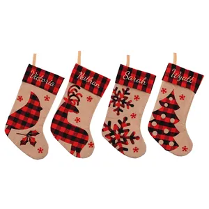 Set of 4 personalized buffalo plaid Christmas stockings with burlap base and festive designs