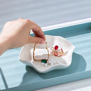 Elegant white flower-shaped ceramic jewelry dish for organizing rings and necklaces