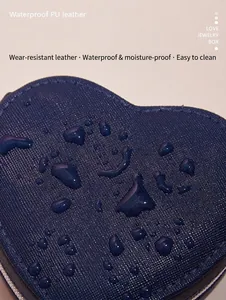 Macro view of waterproof PU leather material on a blue heart-shaped jewelry box