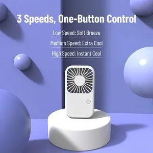 White portable handheld mini fan with three adjustable wind speeds on purple background